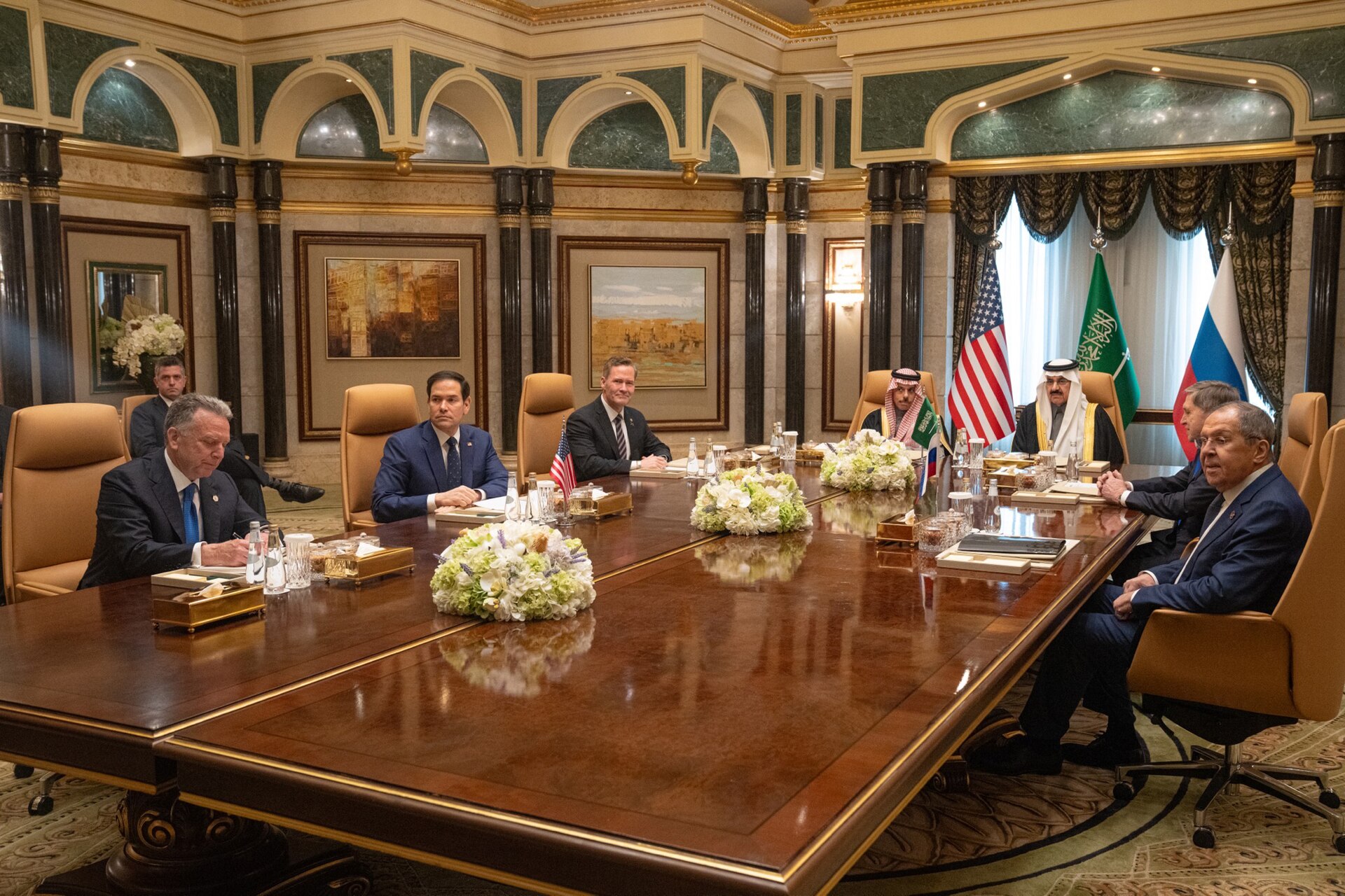 Secretary Rubio meets with Saudi Foreign Minister Faisal bin Farhan and Russian delegation in Riyadh, U.S. and Saudi flags visible on conference table