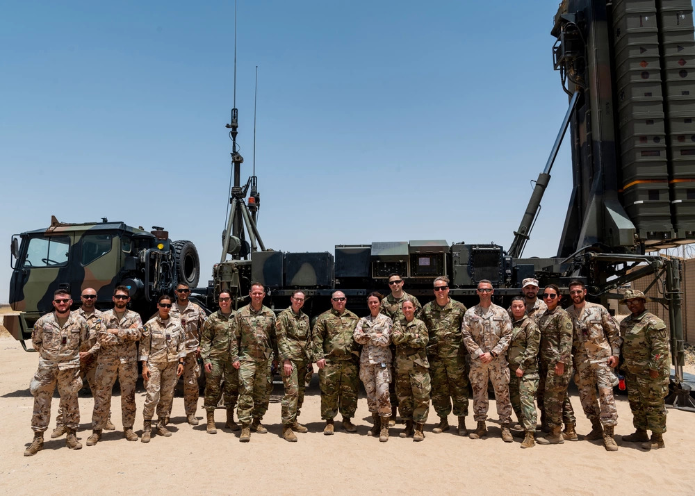 Italian Army SAMP-T air defense launcher and US military personnel at Ali Al Salem Air Base Kuwait, showing the multinational air defense posture at the 386th Air Expeditionary Wing installation