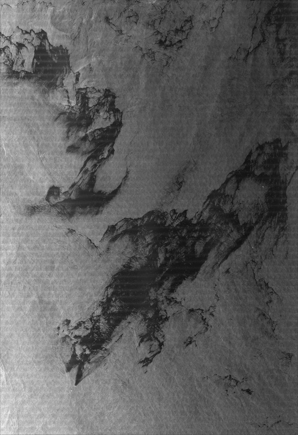TerraSAR-X synthetic aperture radar image showing oil spill dark patches on sea surface Timor Sea DLR
