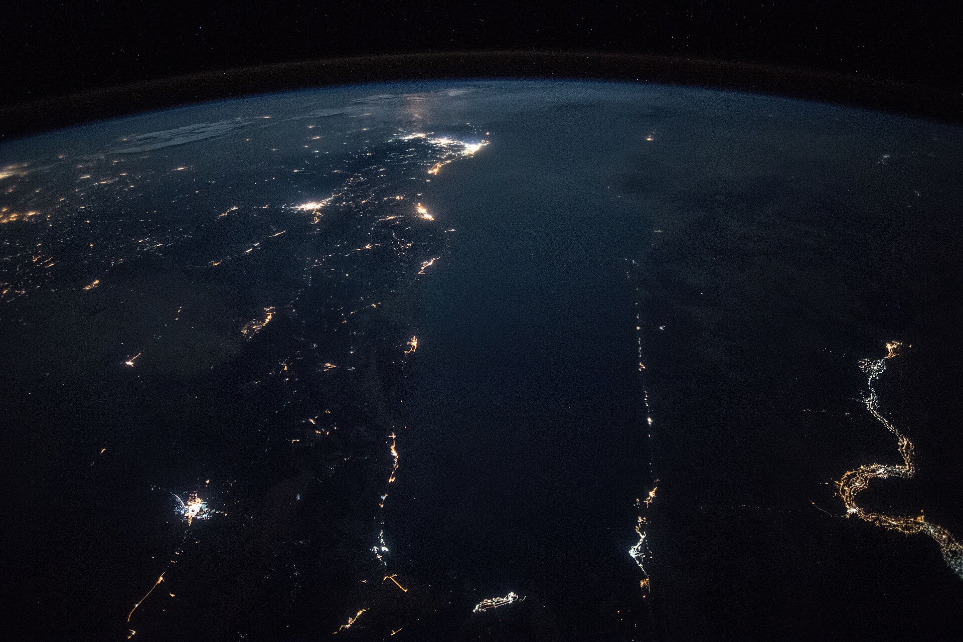 Saudi Arabia and Arabian Peninsula at night from ISS, showing city lights and Red Sea coast during wartime