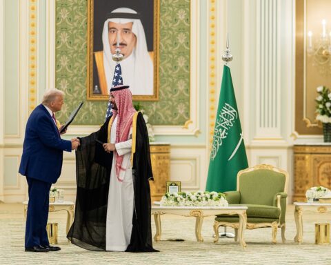 Trump and MBS exchange documents in the State Room at the Royal Court Palace, Riyadh, May 13, 2025