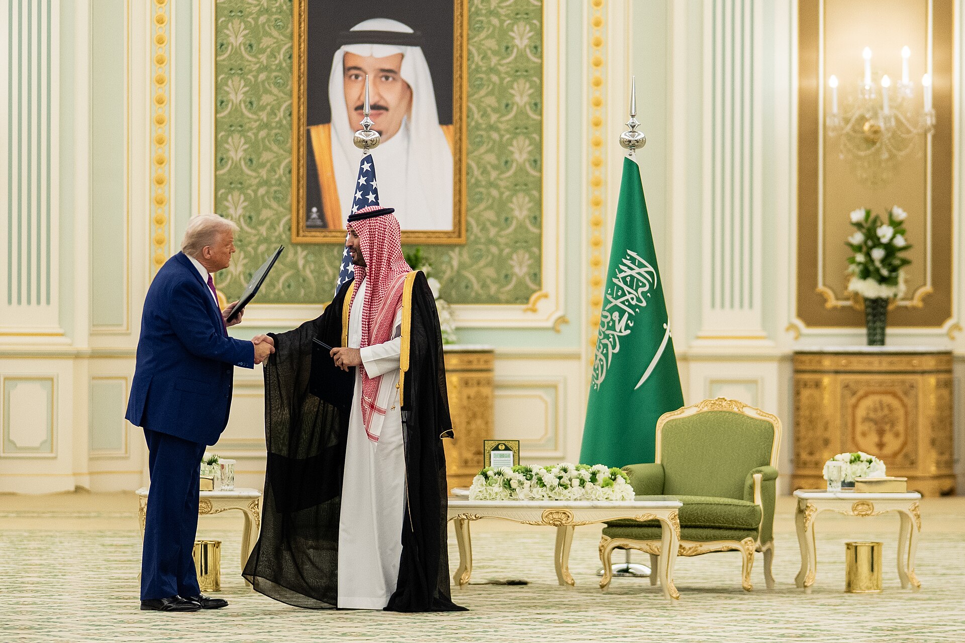Trump and MBS exchange documents in the State Room at the Royal Court Palace, Riyadh, May 13, 2025