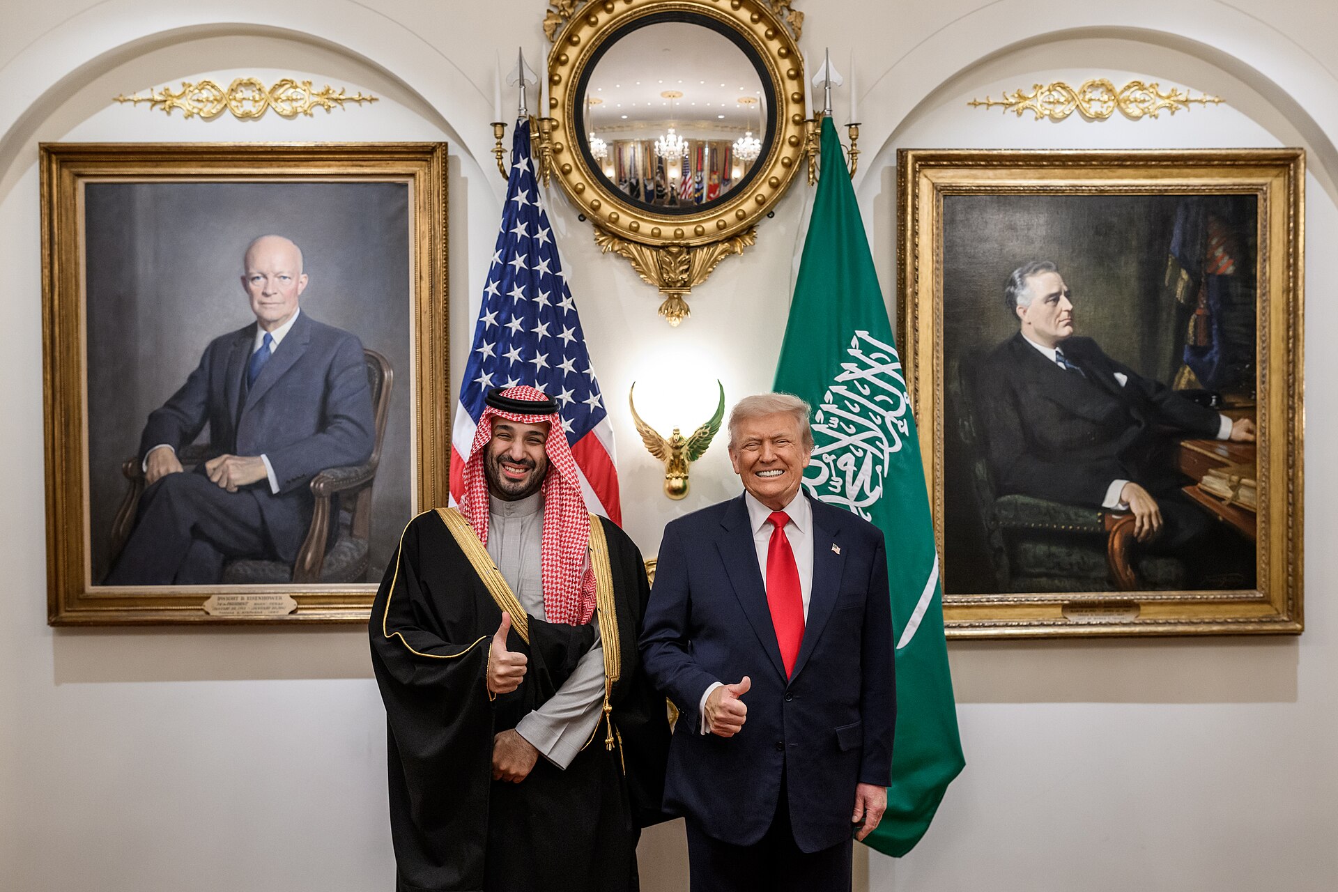 Trump and MBS pose for a portrait in the White House Cabinet Room with US and Saudi flags, November 2025