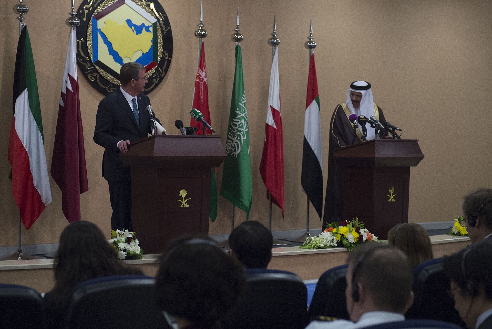 US Defense Secretary Ash Carter and GCC Secretary General at a joint press conference in Riyadh, Saudi Arabia, April 2016, with GCC member-state flags including Saudi Arabia