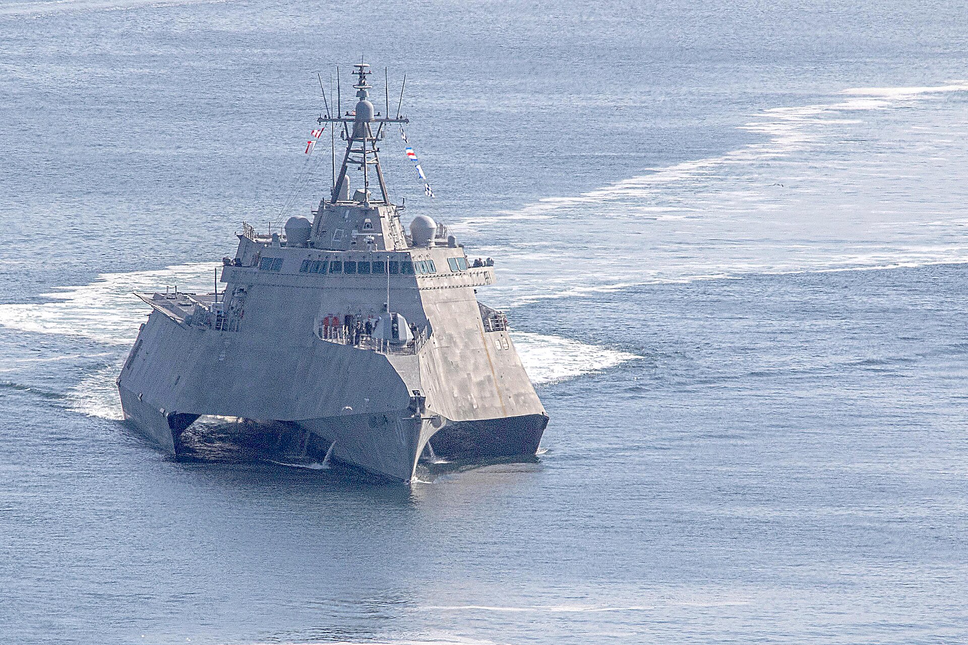 USS Canberra (LCS-30) Independence-class Littoral Combat Ship departing San Diego — the only LCS with mine countermeasures mission package available in theater as of May 2026, sole replacement for four decommissioned Avenger-class MCM ships