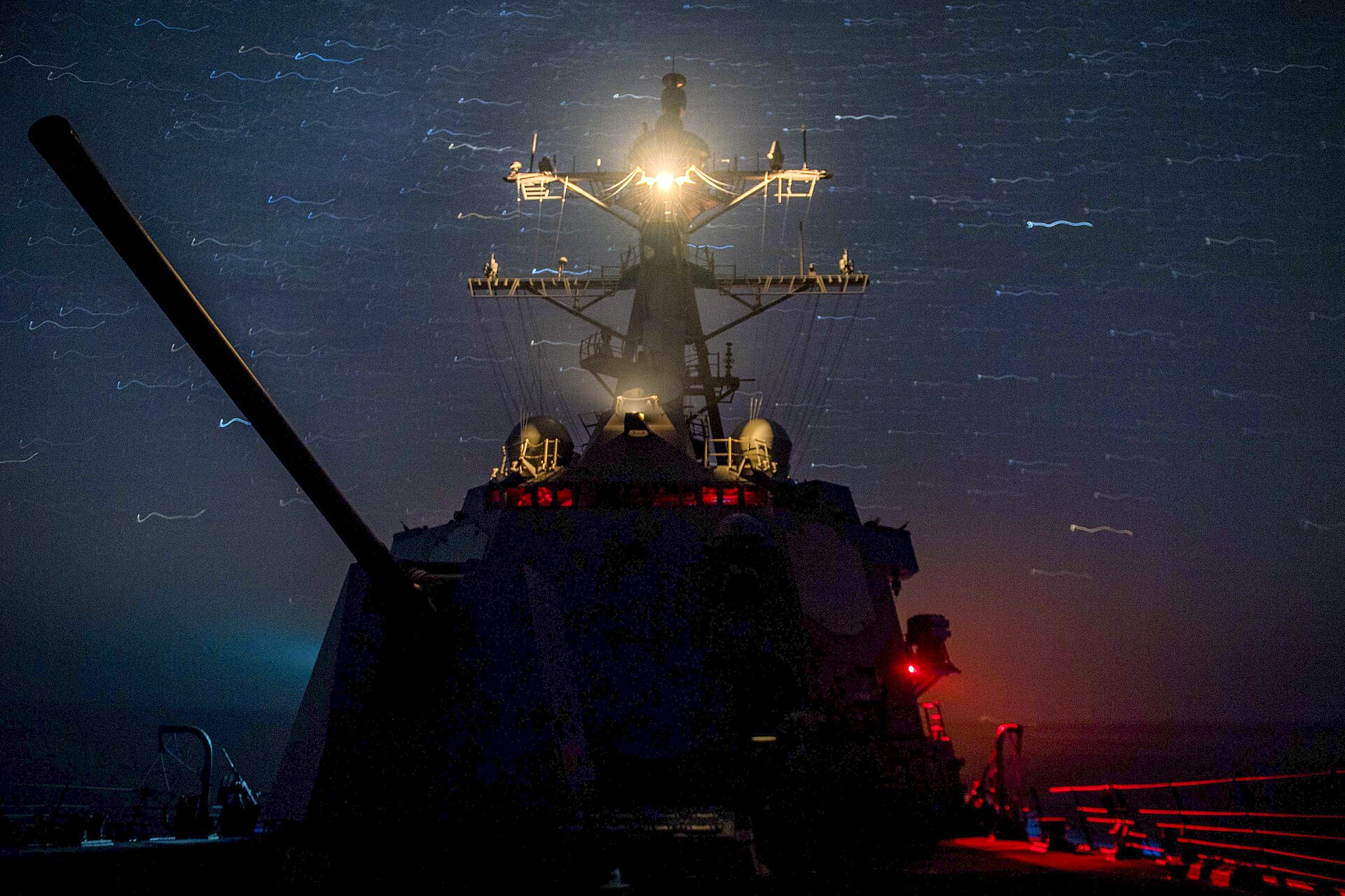 USS Stockdale guided-missile destroyer transiting the Gulf of Oman at night, US 5th Fleet operations