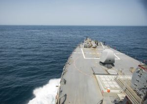 USS Stout (DDG 55) forward deck view transiting the Strait of Hormuz, June 2016, with a tanker visible in the distance