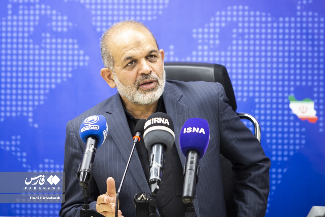 Ahmad Vahidi, IRGC Commander-in-Chief since March 2026, at an Iranian government press conference — Vahidi controls the missile force, IRGC Navy, and Quds Force that any nuclear MOU must constrain