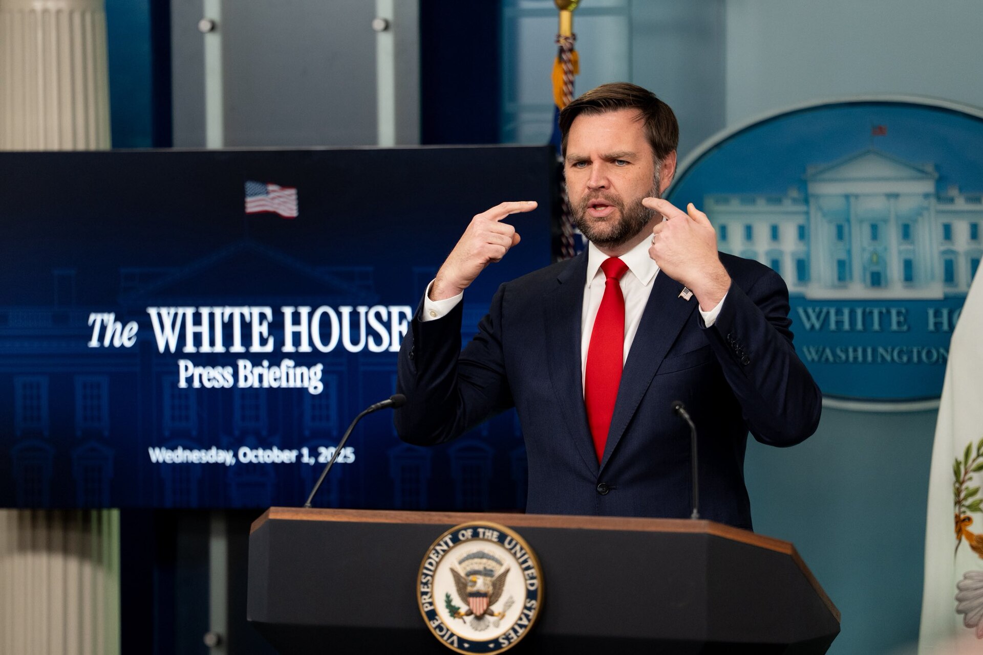 Vice President JD Vance at the White House press briefing podium. Vance stated on May 14, 2026 that the US is making progress in Iran nuclear talks while simultaneously demanding that the Strait of Hormuz be fully opened — a demand the Iranian judiciary declared non-negotiable on the same day.