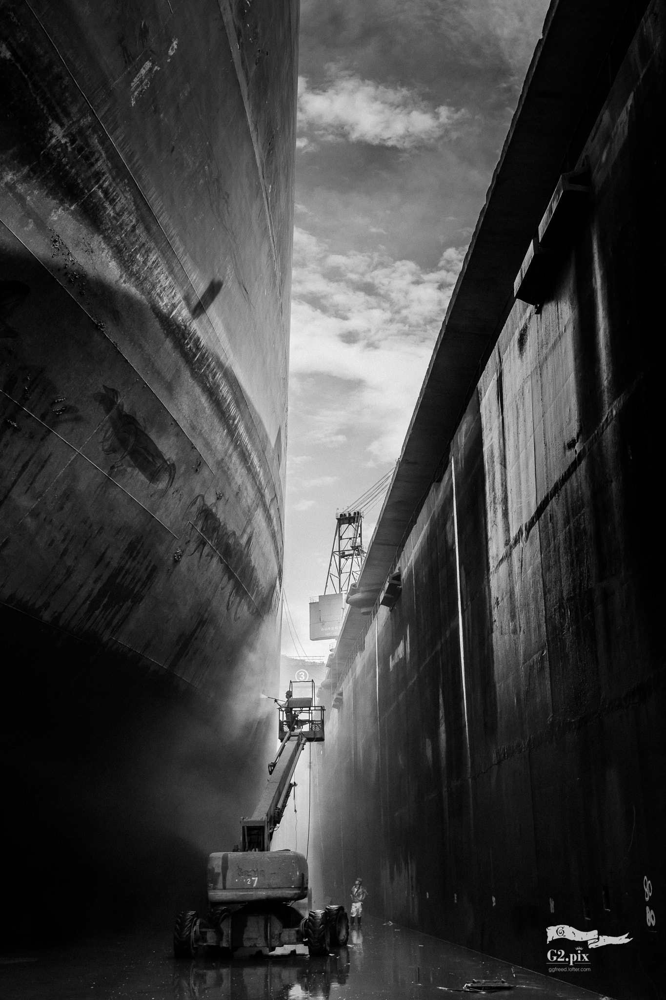 A Very Large Crude Carrier (VLCC) in dry dock undergoing hull maintenance — vessels of this class carry up to 2 million barrels of crude oil and now face IRGC tolls of up to $2 million per transit through the Strait of Hormuz