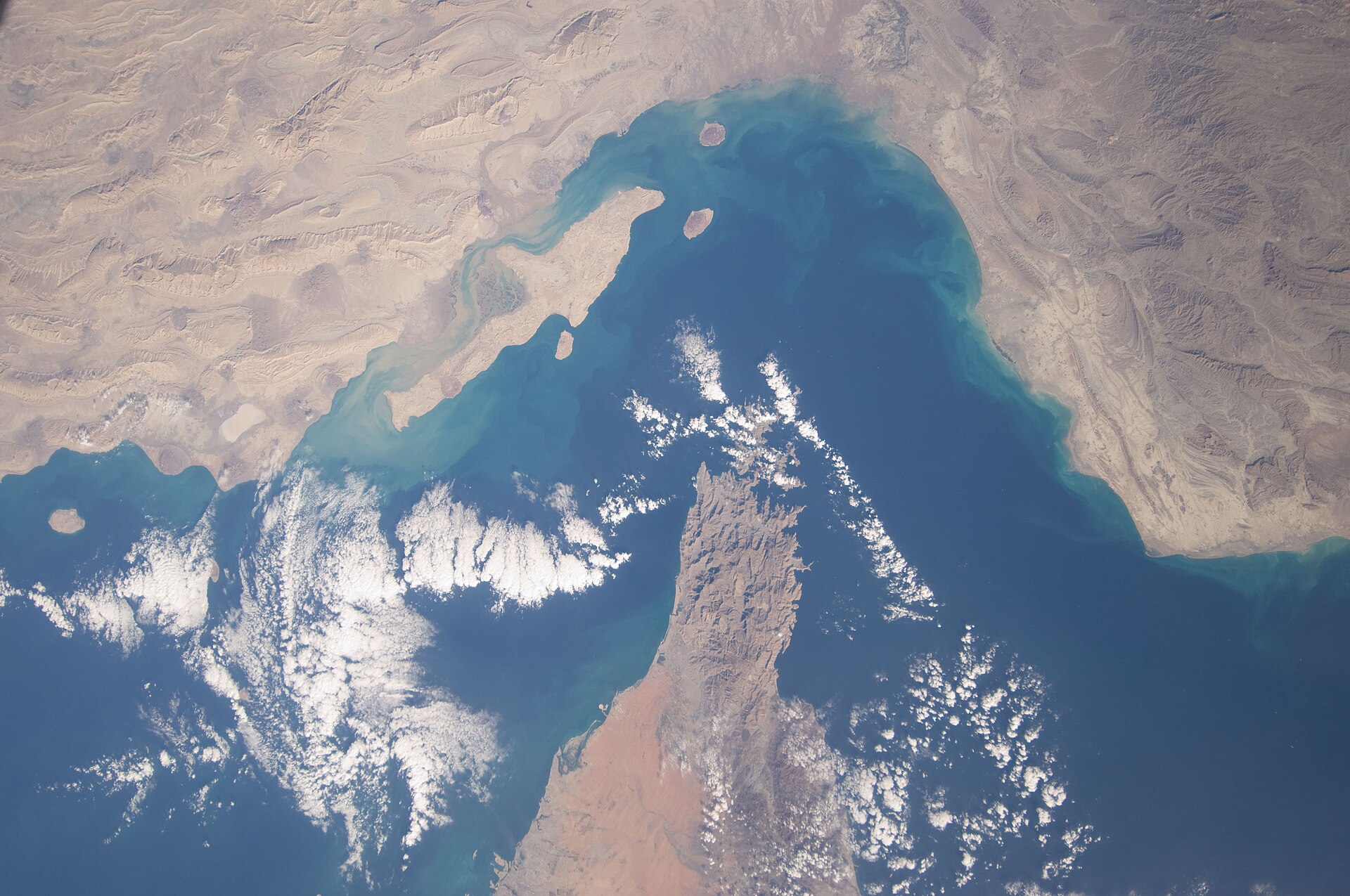 Strait of Hormuz chokepoint from ISS Expedition 22, showing Iran coastline to the north and the Musandam Peninsula jutting into the Gulf from Oman to the south