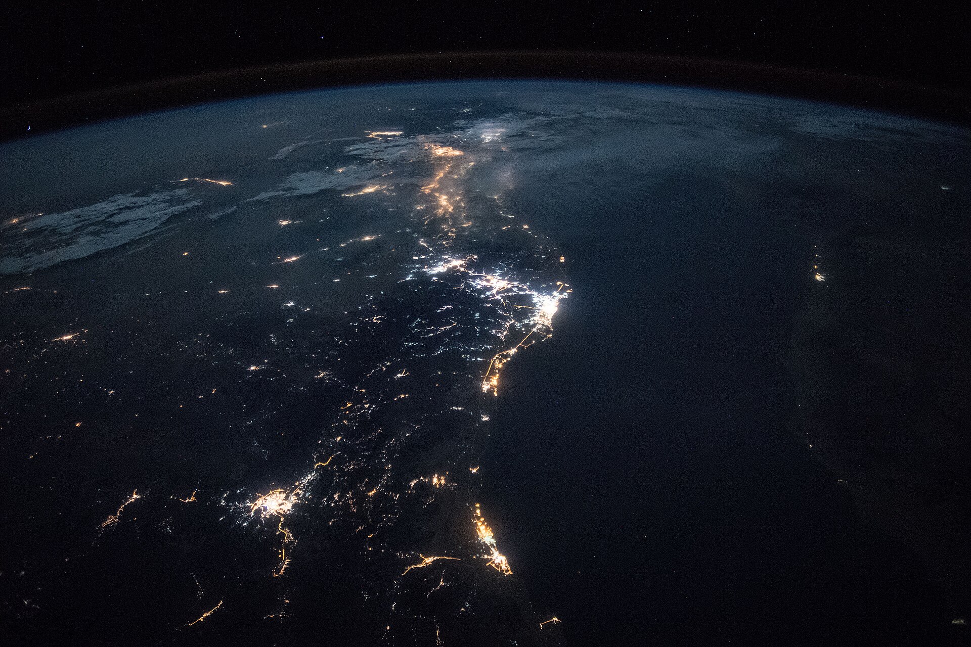ISS astronaut view of Saudi Arabia Red Sea coastline at night showing city lights along Jeddah Yanbu corridor