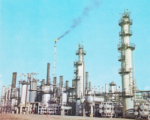 Abadan oil refinery catalytic facilities, Khuzestan Province, Iran — same province as Mahshahr PETZONE. Distillation columns and gas flare visible.
