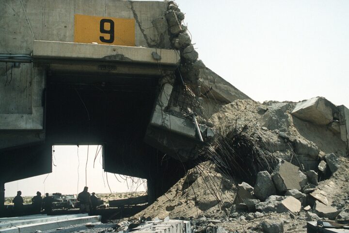 Hardened aircraft shelter at Ali Al-Salem Air Base, Kuwait, damaged by bombing — the base has absorbed five IRGC strikes since March 2026