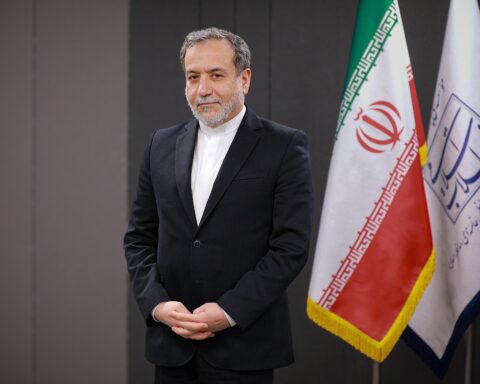 Iranian Foreign Minister Abbas Araghchi in an official interview setting with Iranian flag, 2025 — khamenei.ir