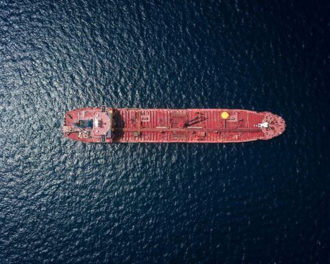 Aerial view of an oil tanker underway in the Persian Gulf — the route Aramco crude must clear before reaching export markets