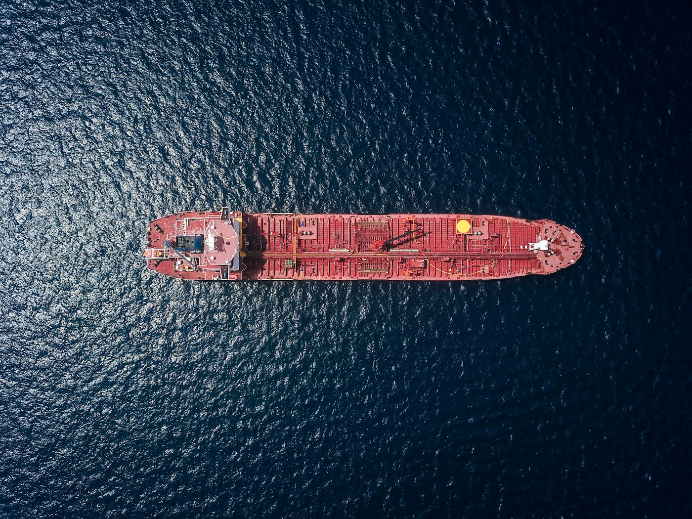 Aerial view of an oil tanker underway in the Persian Gulf — the route Aramco crude must clear before reaching export markets