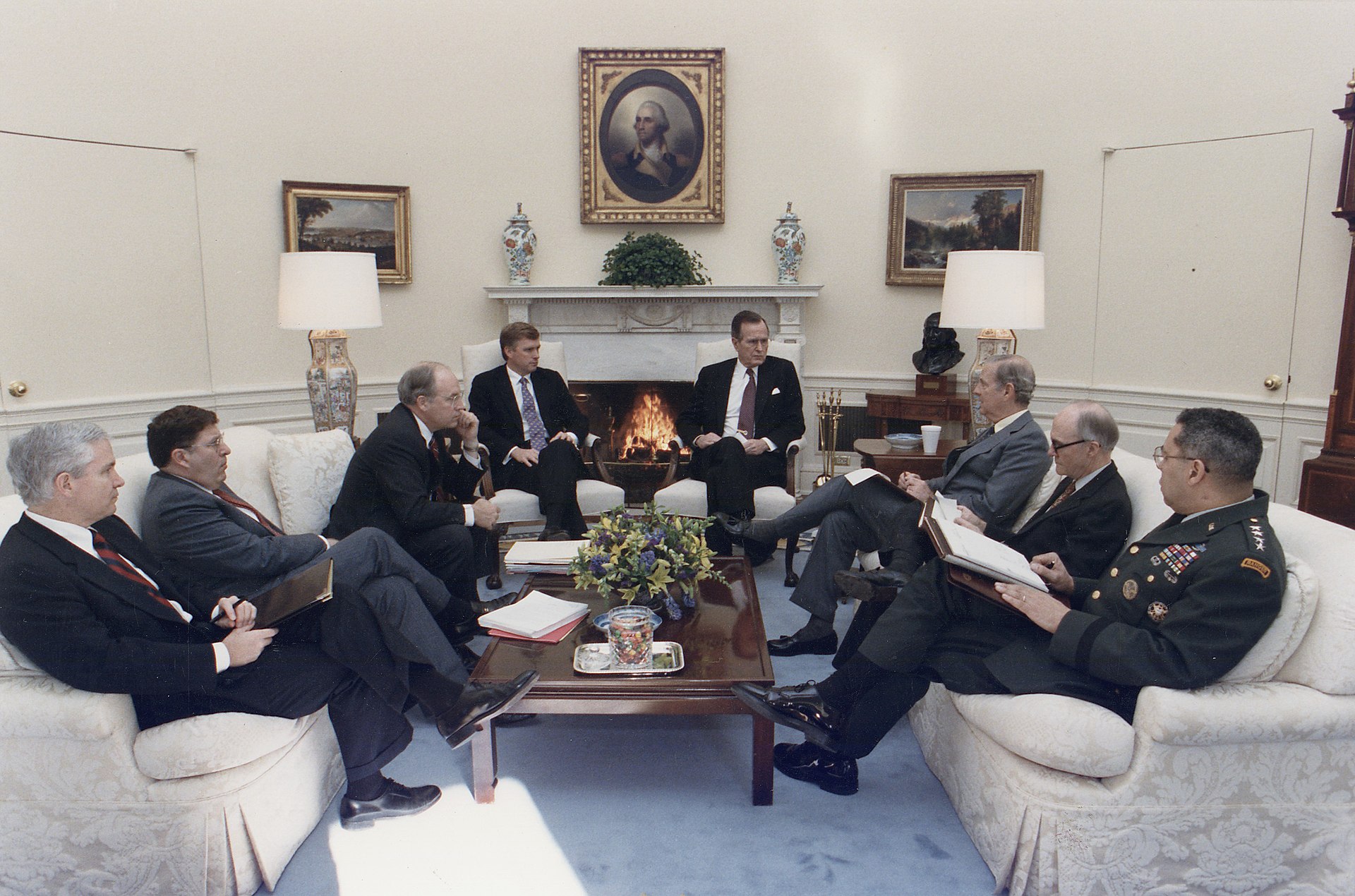 President George H.W. Bush meets with Secretary James Baker, General Colin Powell, General Scowcroft and Vice President Quayle in the Oval Office during the Gulf War, 1990