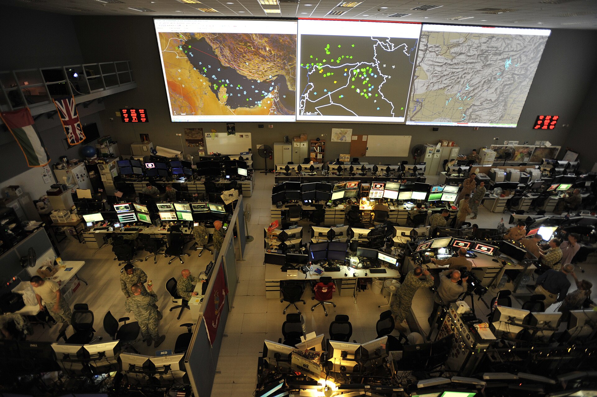 Combined Air Operations Center (CAOC) interior at Al Udeid Air Base, Qatar — joint and coalition operators manage air operations across Iraq, Syria, and the broader CENTCOM region from this facility