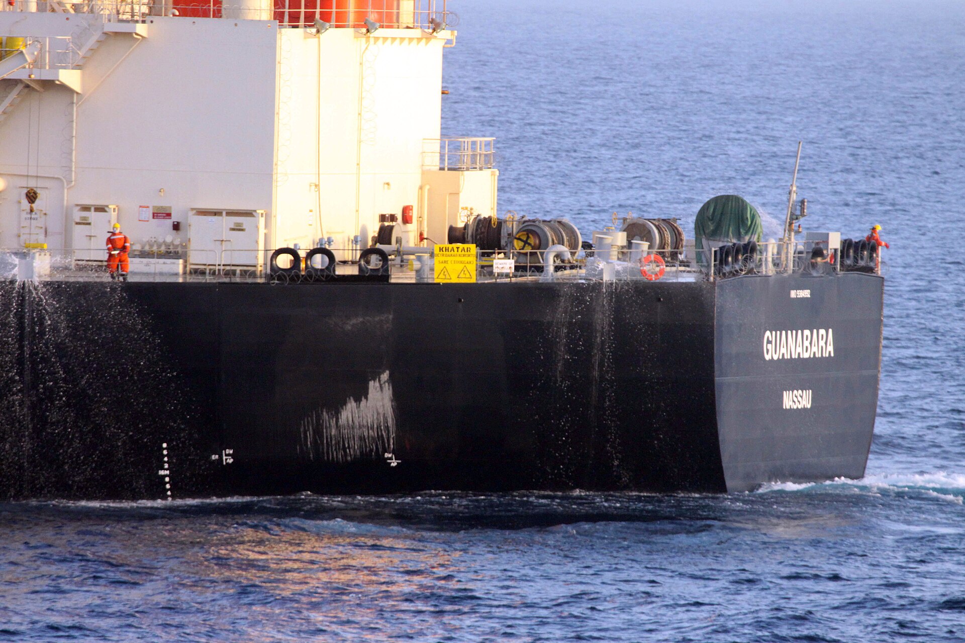 Commercial oil tanker MV Guanabara in the Arabian Sea, escorted by US Navy and Turkish frigate — approximately 850 tankers remain stranded or queued around the Strait of Hormuz pending verified mine-free clearance