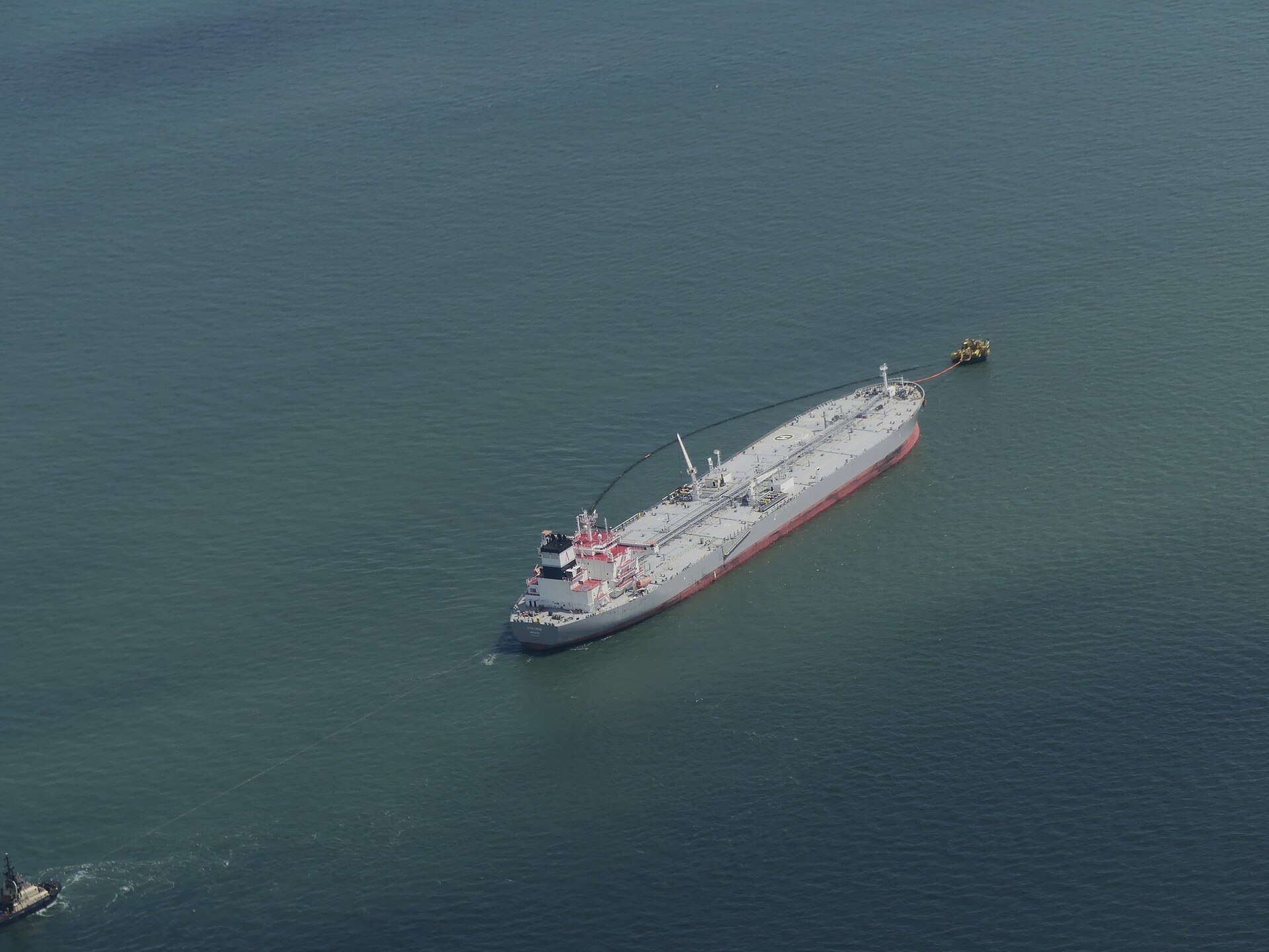 Crude oil tanker Strymon at a monobuoy offloading terminal, 2024 aerial photograph showing scale of crude oil shipping infrastructure dependent on open sea lanes