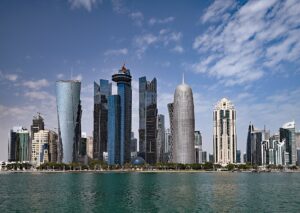 Doha West Bay skyline daytime view from waterfront showing distinctive towers including the twisted Burj Doha