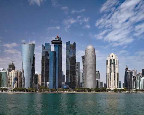 Doha West Bay skyline daytime view from waterfront showing distinctive towers including the twisted Burj Doha