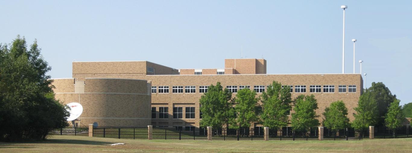 Dow Chemical corporate headquarters in Midland, Michigan. Dow disclosed a $292 million Sadara guarantee liability adjustment in its Q1 2026 10-Q and CEO Jim Fitterling directed investors to expect a midyear update in late July — creating a six-week post-deadline window with no mandatory filing.