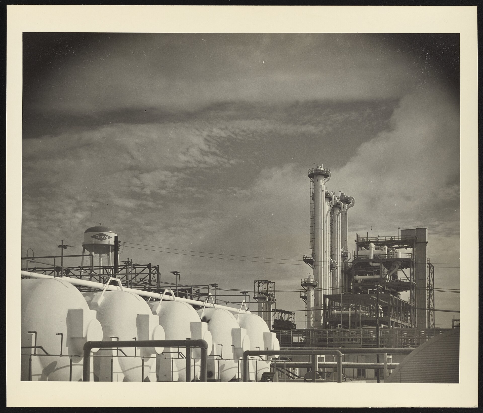 Dow Chemical Company plant at Freeport, Texas — the DOW water tower logo marks the facility that anchors Dow Inc.'s industrial operations. Dow's 35 percent stake in the $3.7 billion Sadara guarantee remains a contingent cash liability that GAAP treatment has rendered invisible to investors tracking quarterly earnings. Photo: Dow Chemical Company / No restrictions