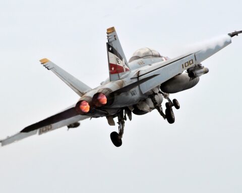 F/A-18F Super Hornet launches from USS Abraham Lincoln (CVN-72) in the North Arabian Sea, July 2008 — the same carrier strike group enforcing the Gulf of Oman blockade that disabled the M/T Marivex on June 8, 2026