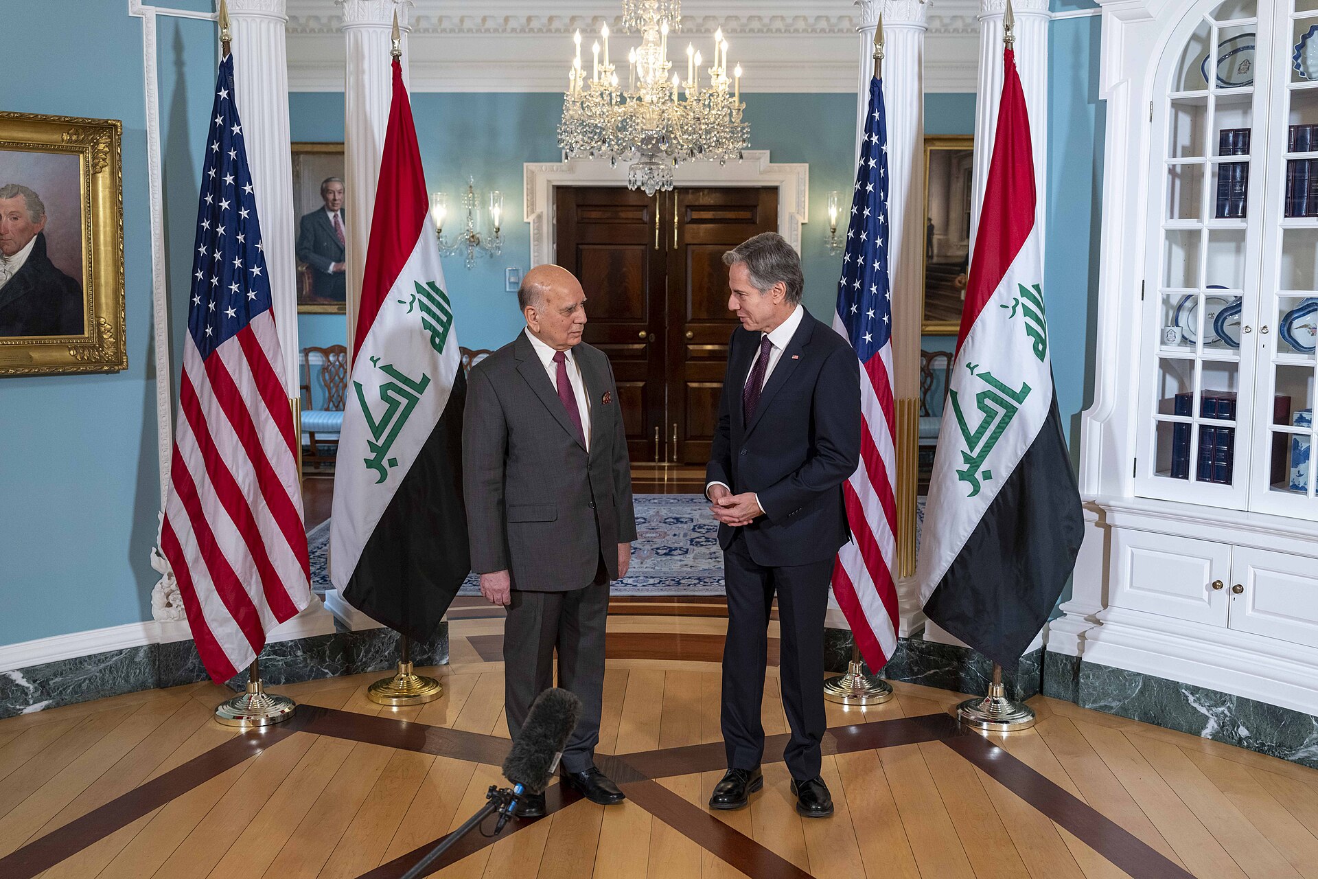 Iraqi Foreign Minister Fuad Hussein (left) addresses reporters alongside US Secretary of State Blinken at the State Department, February 9, 2023 — Hussein issued the eight-party Baghdad regional security summit invitation on June 28, 2026