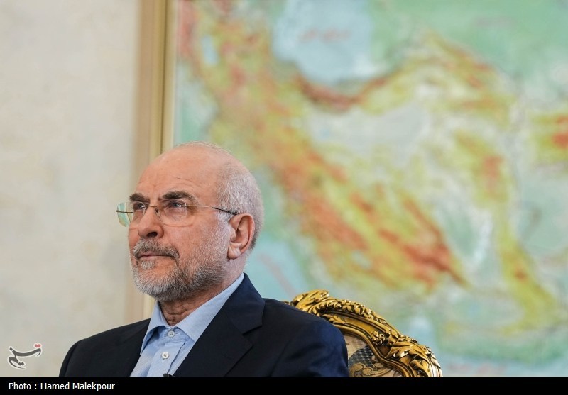 Qalibaf during his CNN interview in 2026, seated before a large map of the Middle East in what appears to be an official Iranian government reception room — the setting in which he conducted negotiations over the Islamabad MOU framework