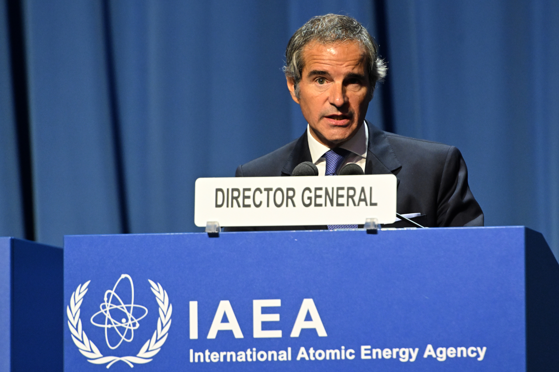 IAEA Director General Rafael Mariano Grossi at the DIRECTOR GENERAL podium with IAEA logo, delivering his opening statement at the 68th General Conference in Vienna, September 2024