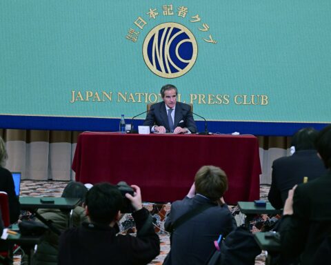IAEA Director General Rafael Grossi addresses reporters at the Japan National Press Club in Tokyo, February 2025, with the JNPC banner and assembled press corps visible
