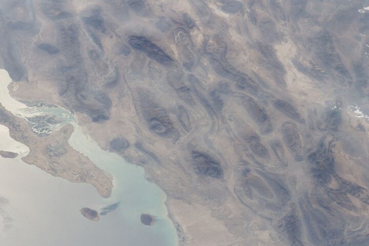 Strait of Hormuz and Qeshm Island viewed from the International Space Station, showing the narrow chokepoint between Iran and Oman through which a third of global seaborne oil once passed