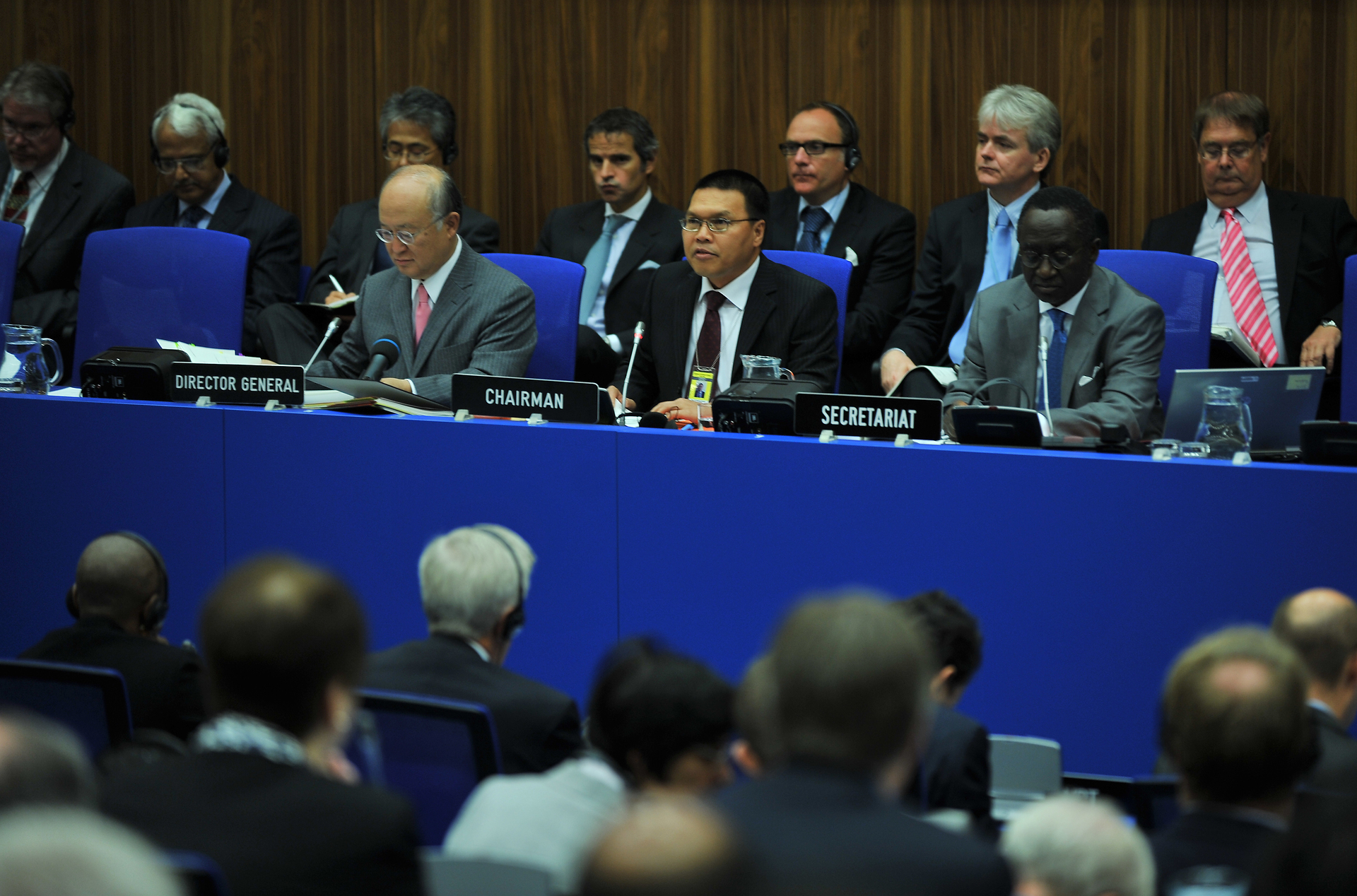 IAEA Board of Governors session in Vienna showing the Director General, Chairman, and Secretariat at the head table with member-state delegates