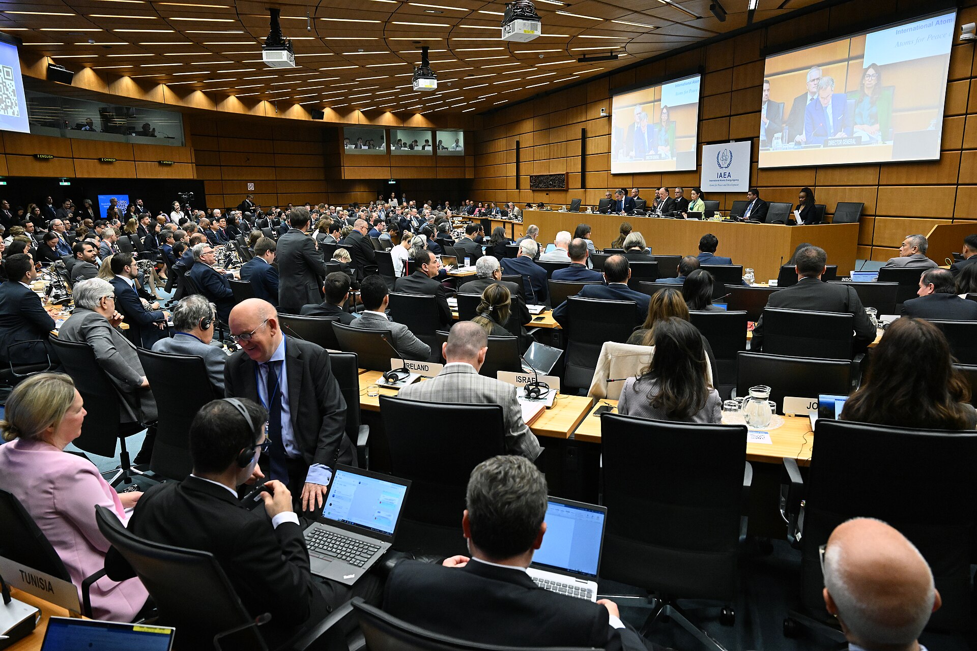 Delegates at the IAEA 1717th Board of Governors meeting at IAEA headquarters in Vienna, Austria, June 2024, with IAEA signage visible on the chamber screen