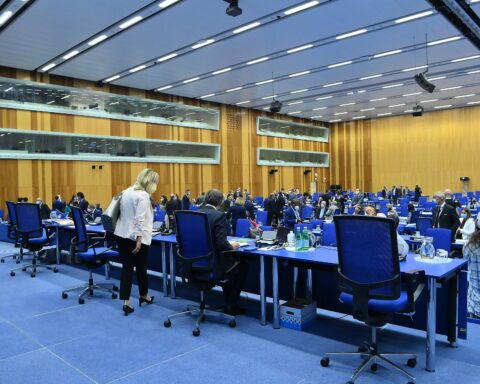 IAEA Board of Governors plenary session in Vienna, delegates seated at the circular arrangement in the M-Building conference hall