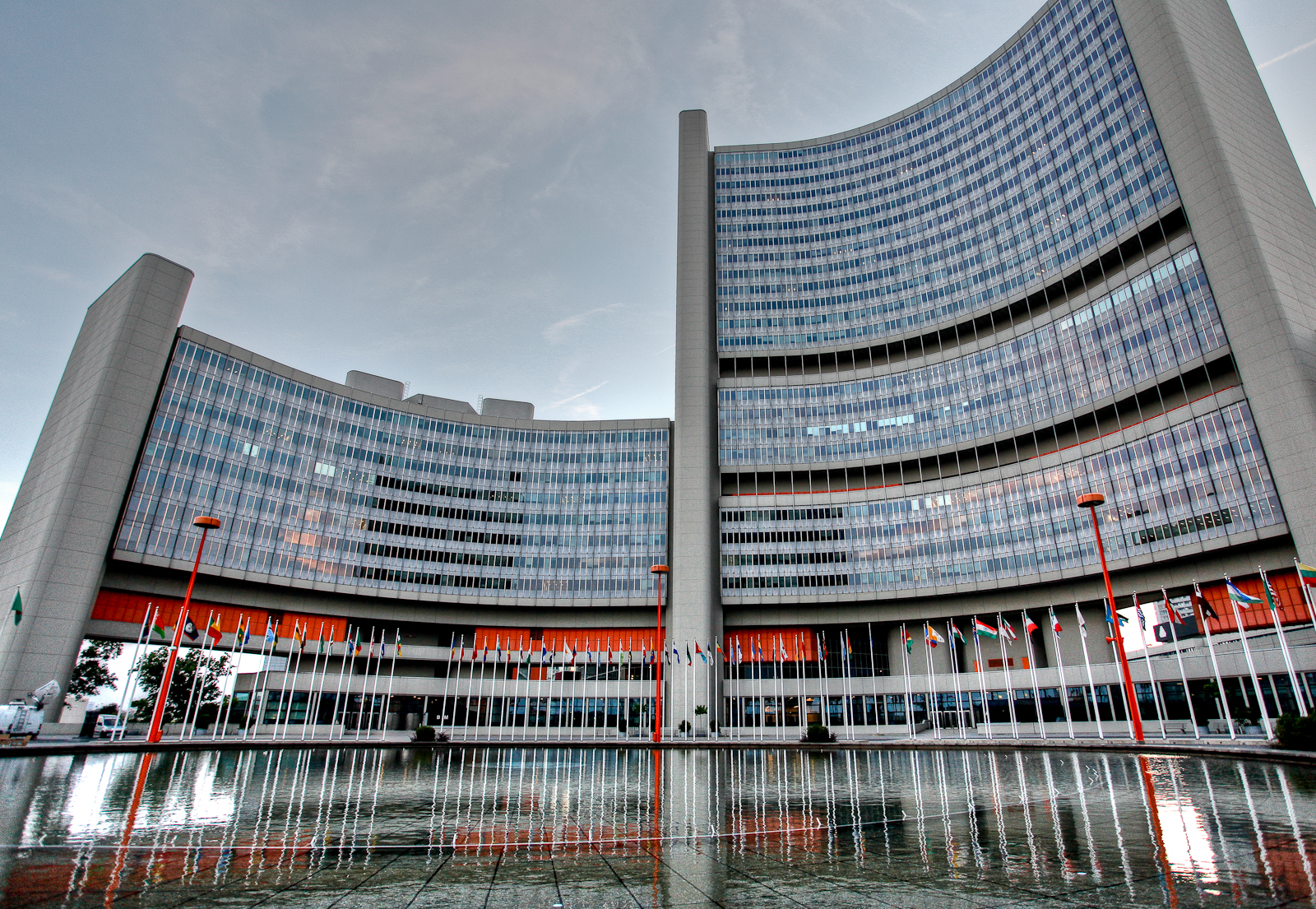 The Vienna International Centre, headquarters of the International Atomic Energy Agency, with member state flags at the entrance