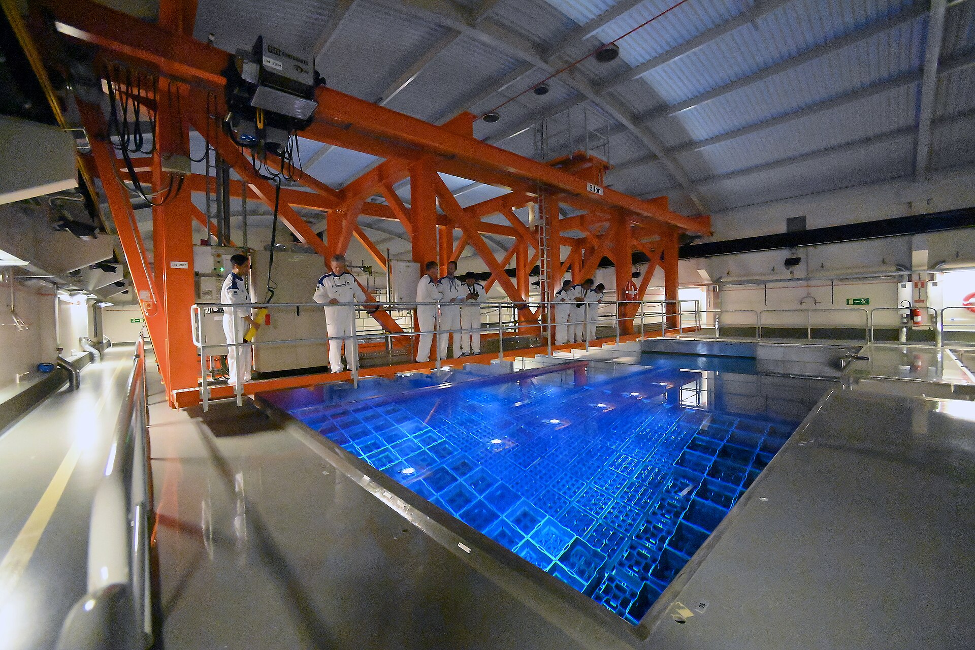 IAEA safeguard inspectors in protective suits conduct spent nuclear fuel verification training at Swedish CLAB facility November 2021