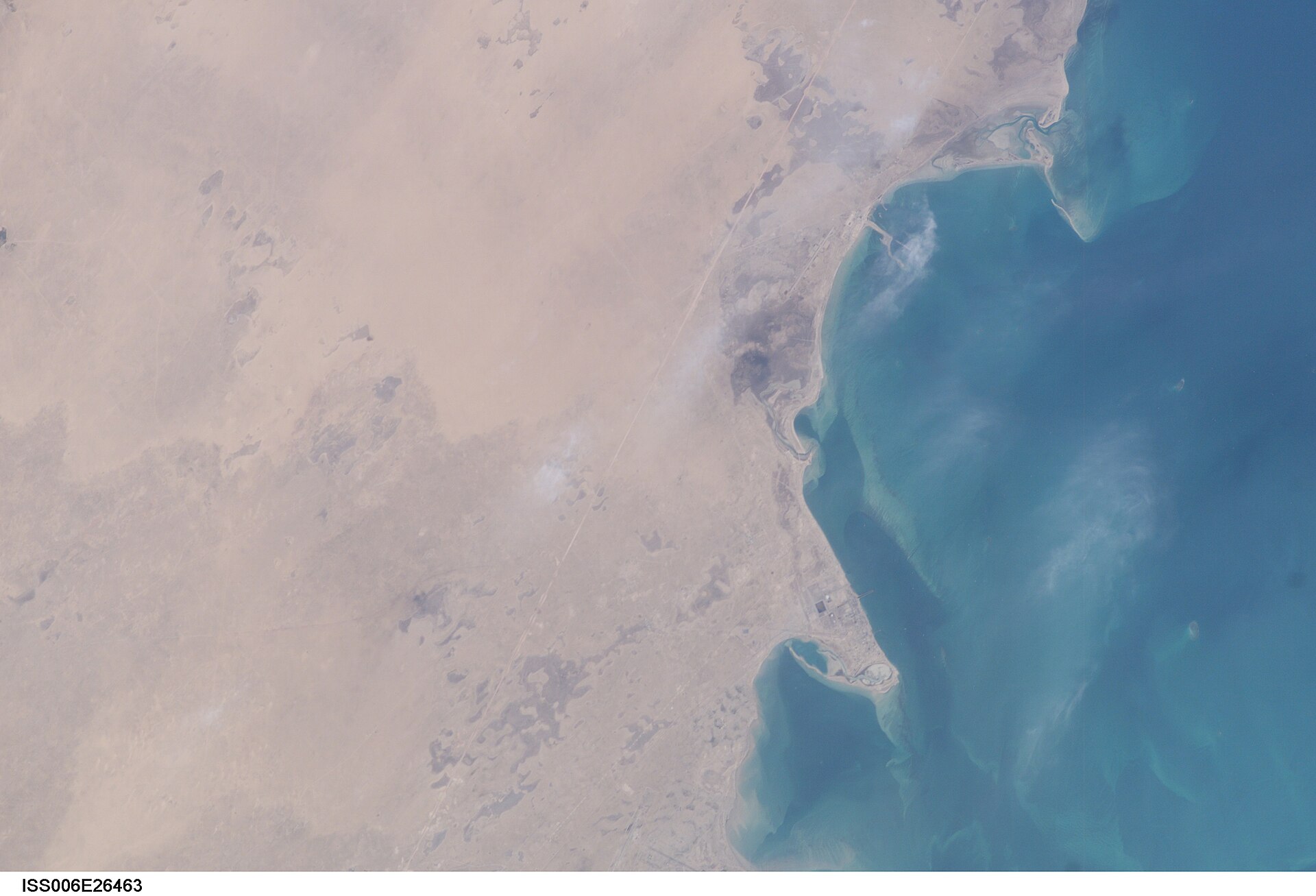 NASA ISS photograph of Saudi Arabia Eastern Province coastline and Persian Gulf, showing Ras Tanura peninsula and offshore waters