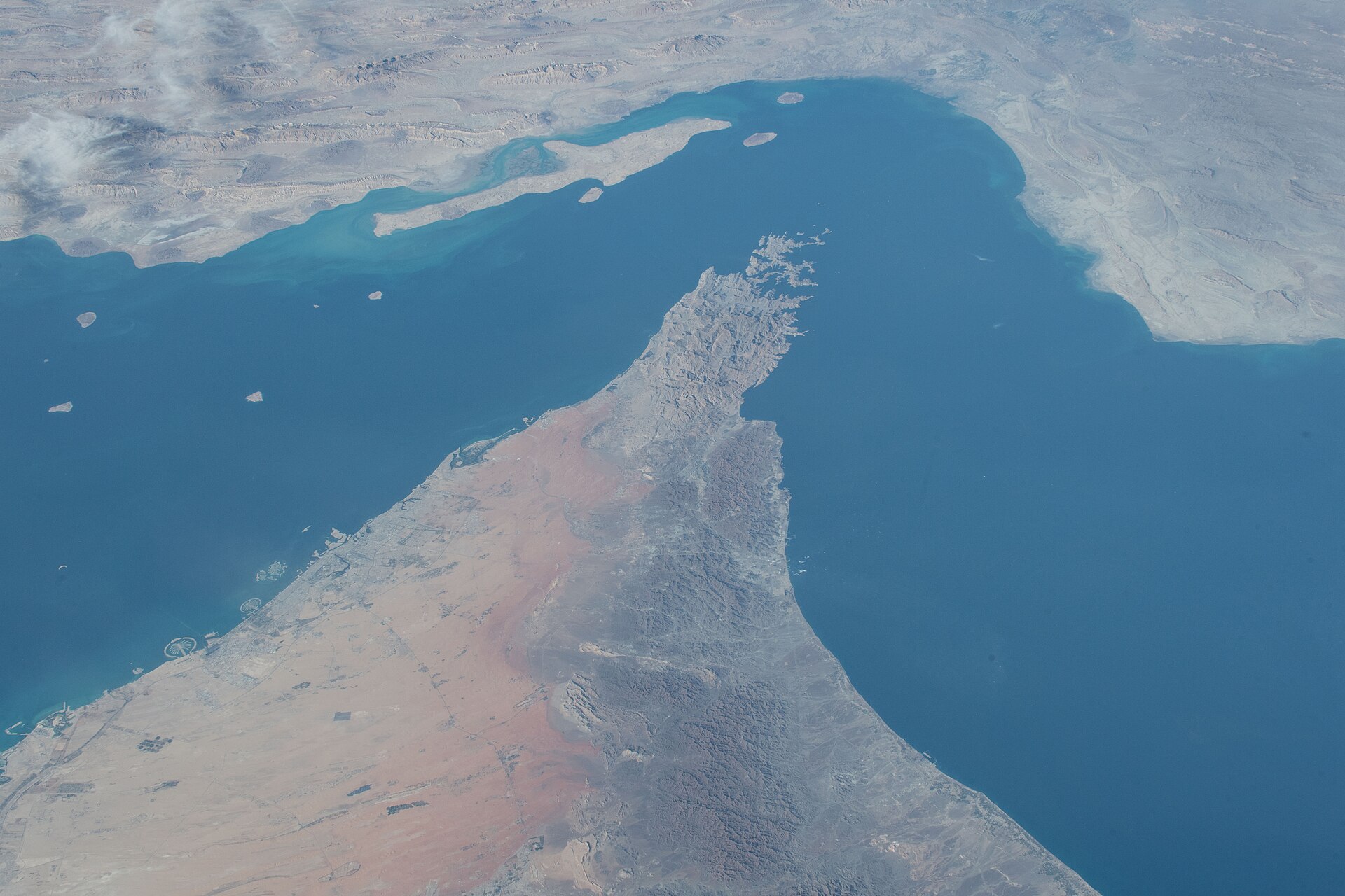 ISS Expedition 57 satellite photograph of the Strait of Hormuz chokepoint, showing the Musandam Peninsula of Oman flanked by the Persian Gulf to the west and Gulf of Oman to the east