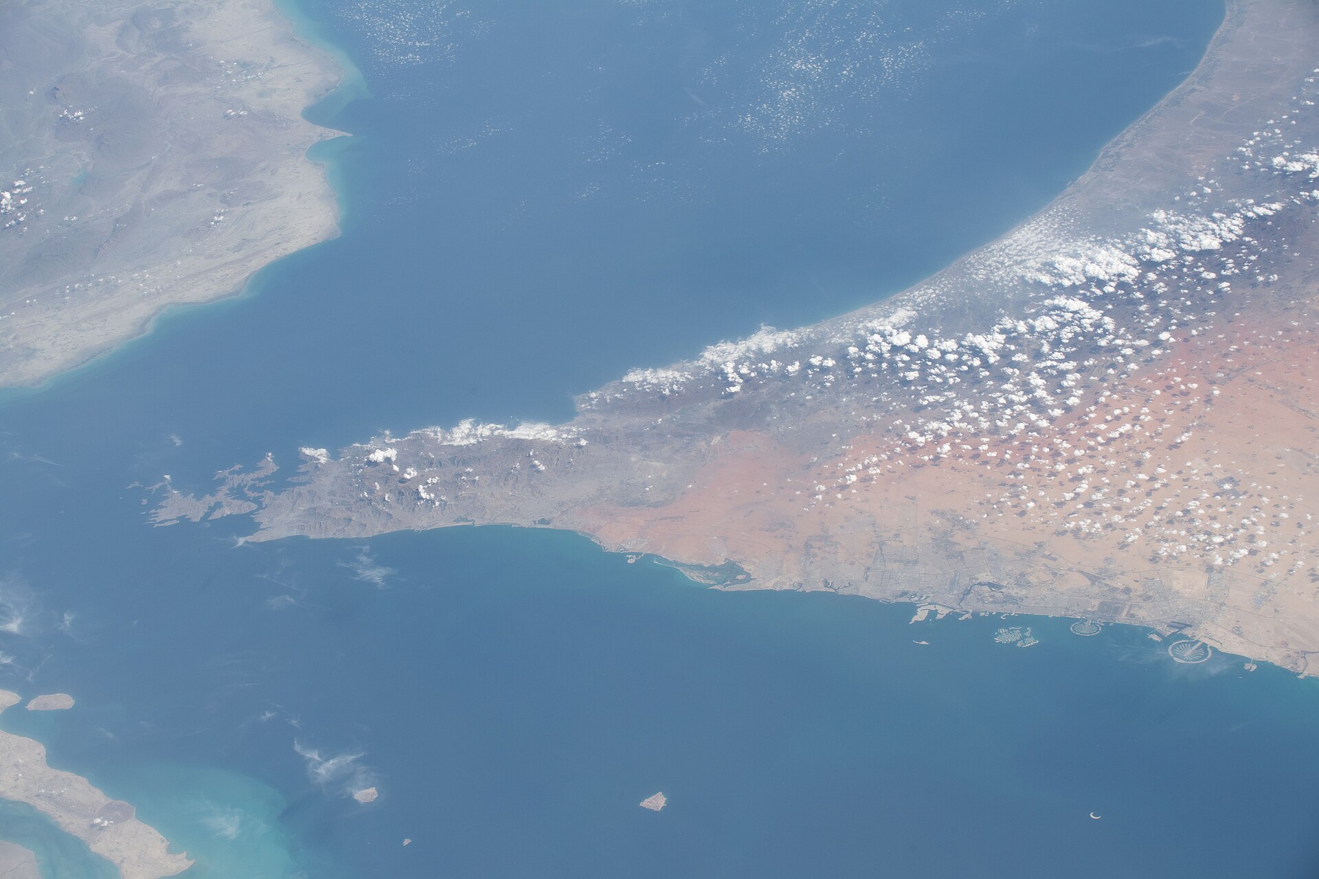 Persian Gulf, Strait of Hormuz, and Gulf of Oman photographed from ISS Expedition 62, showing the UAE coastline and the narrow chokepoint through which 23-plus VLCCs were converging as Bürgenstock talks were reduced to deputy level