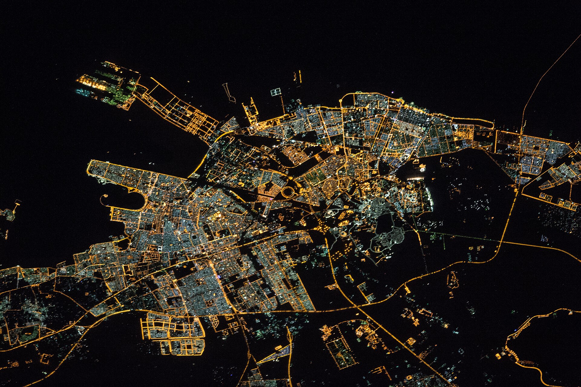 Dammam, Saudi Arabia at night photographed from the International Space Station, showing the Persian Gulf port city and coastline