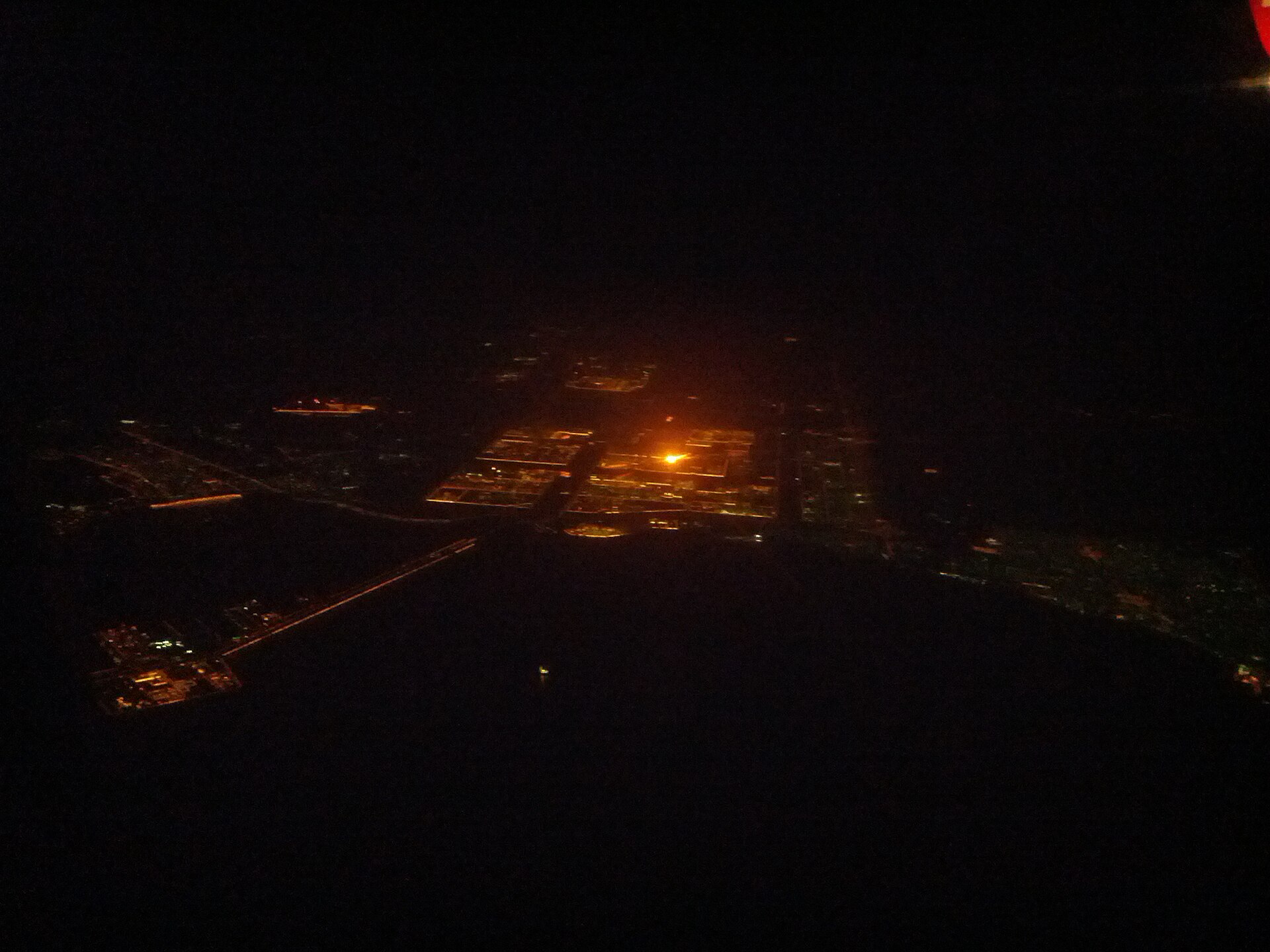 Jubail Industrial City, Saudi Arabia's Eastern Province, photographed from an airliner departing Dammam — the industrial grid below includes Sadara Chemical Company's 26 production units, generating zero revenue since March 31, 2026