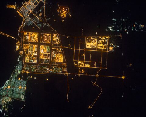 Jubail Industrial City at night photographed from the International Space Station — the glowing industrial grid in the upper centre is the $20 billion Sadara petrochemical complex, with all 26 manufacturing units offline since March 31, 2026. Photo: NASA/ISS Expedition 45 / Public domain
