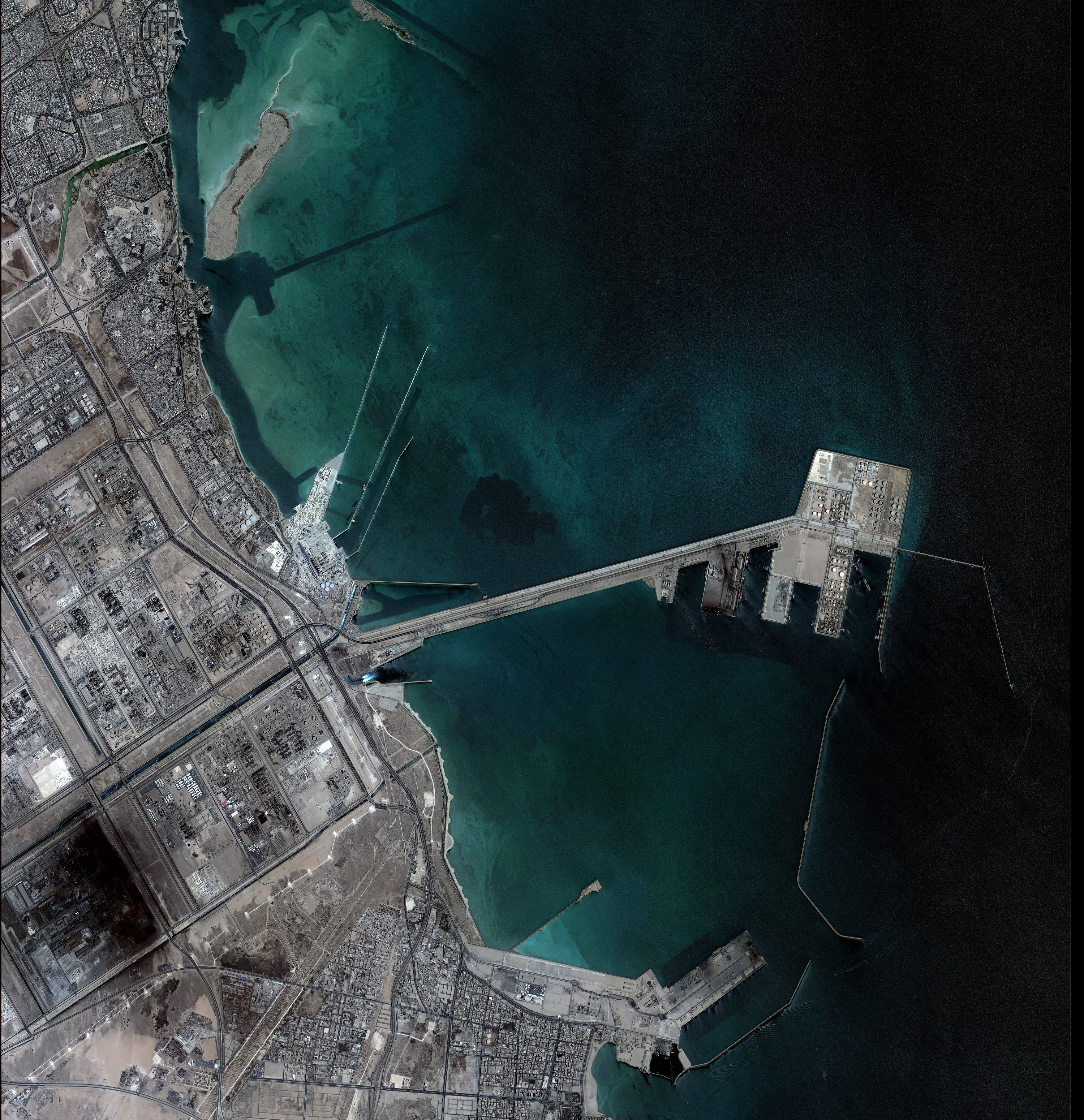Satellite image of Jubail Industrial City port and petrochemical complex on Saudi Arabia's Gulf coast, where Sadara Chemical's 26 units have been offline since late March 2026