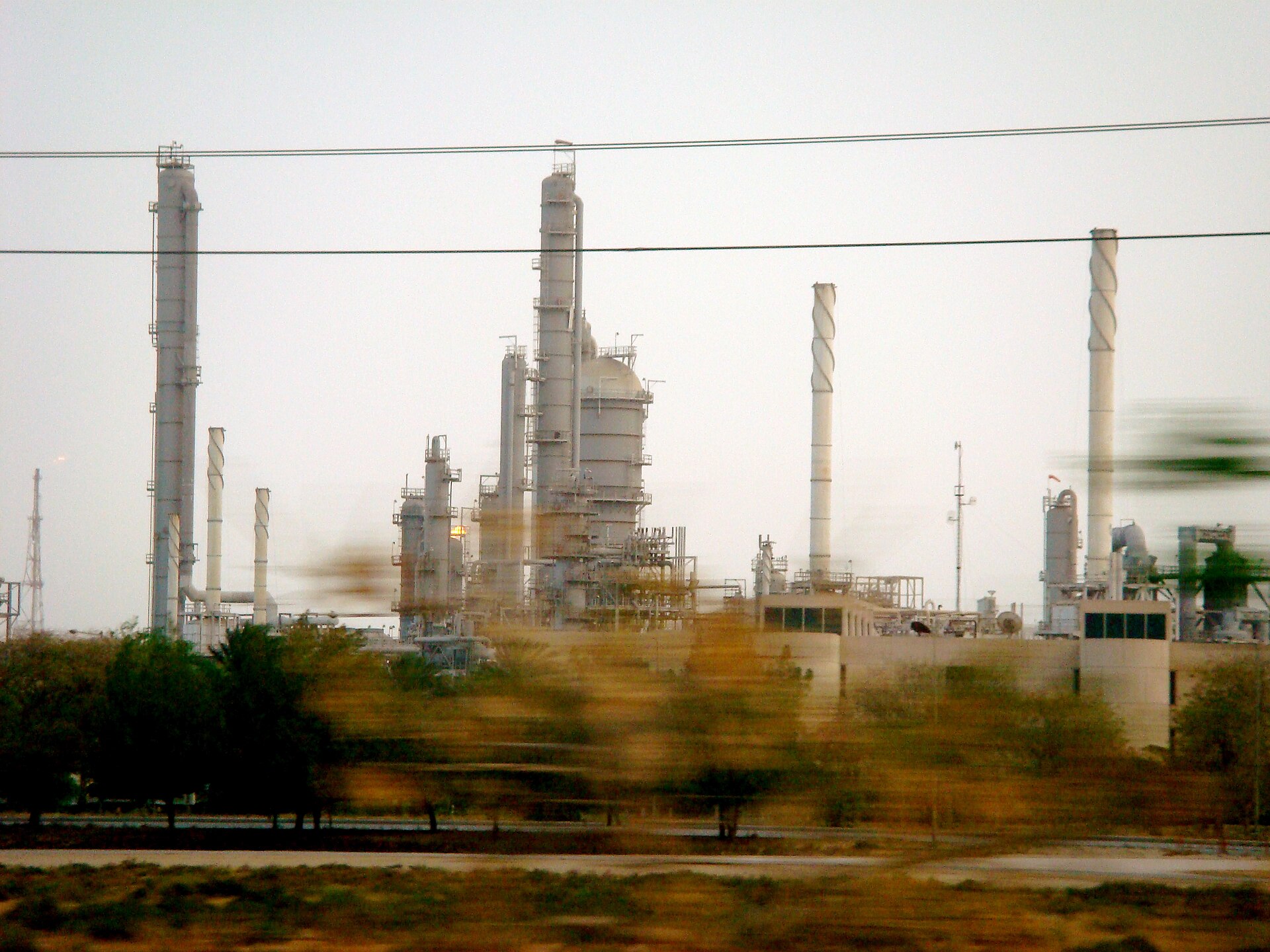 Petrochemical industrial plants at Jubail Industrial City, Saudi Arabia — the site of Sadara Chemical Company's 26-unit complex, which remained offline for eleven weeks as its $3.7 billion guaranteed senior debt expired on June 15, 2026.