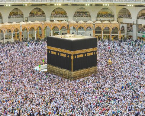 Grand Mosque in Mecca during Hajj, pilgrims performing tawaf around the Kaaba