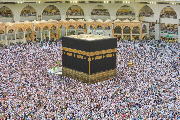 Grand Mosque in Mecca during Hajj, pilgrims performing tawaf around the Kaaba